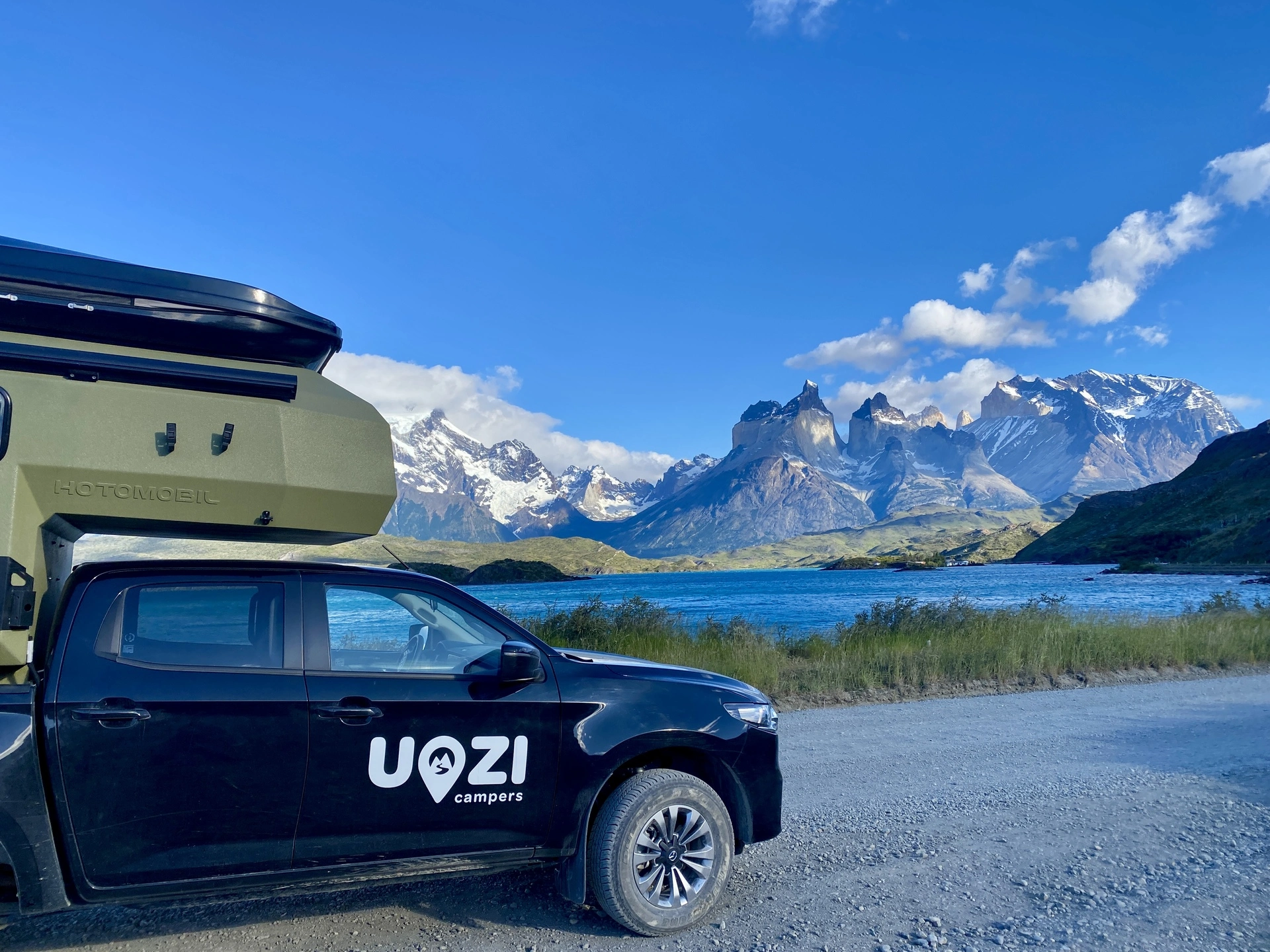 Uozi camper facing the Cuernos del Paine and Lake Pehoé