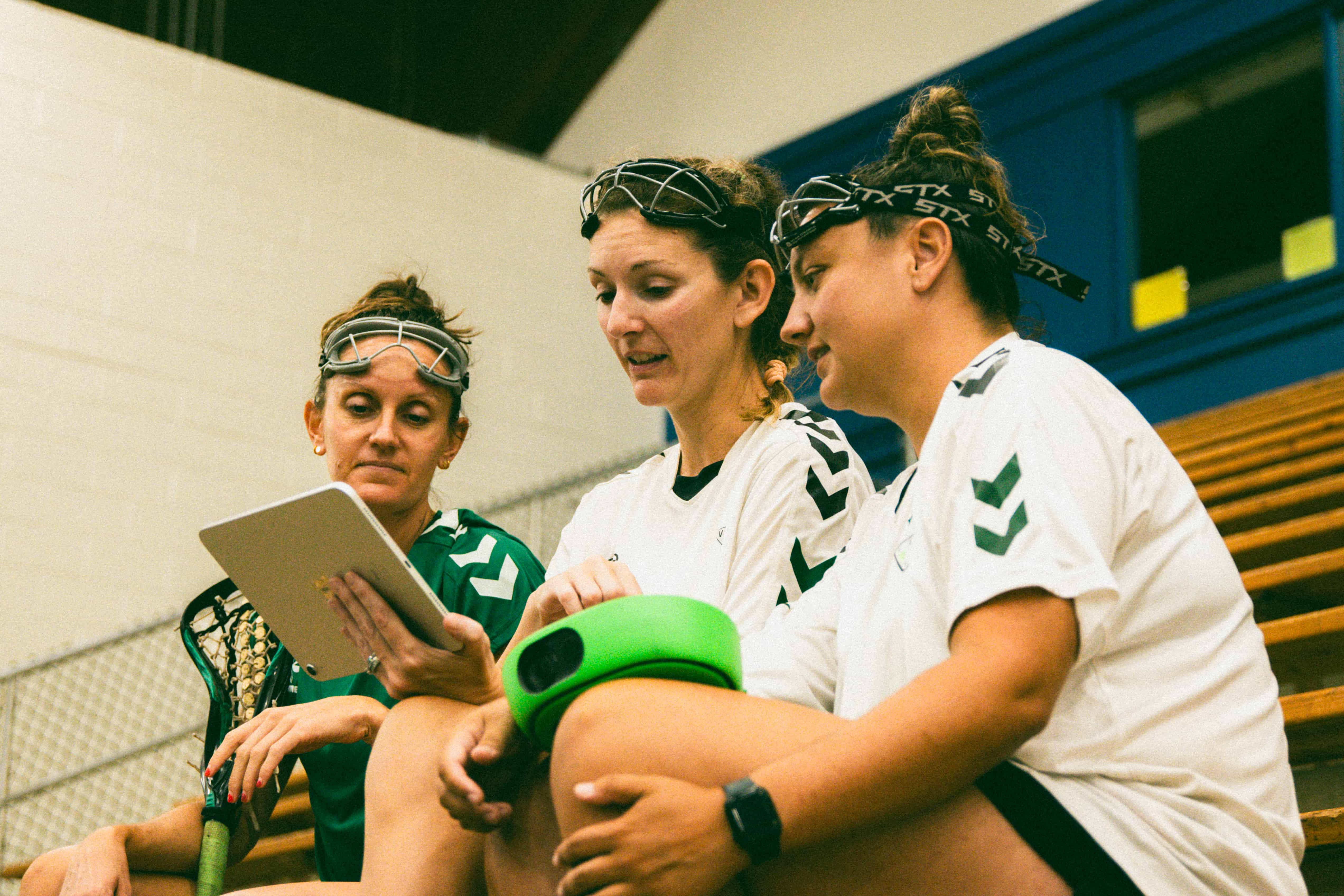 Youth lacrosse players on field