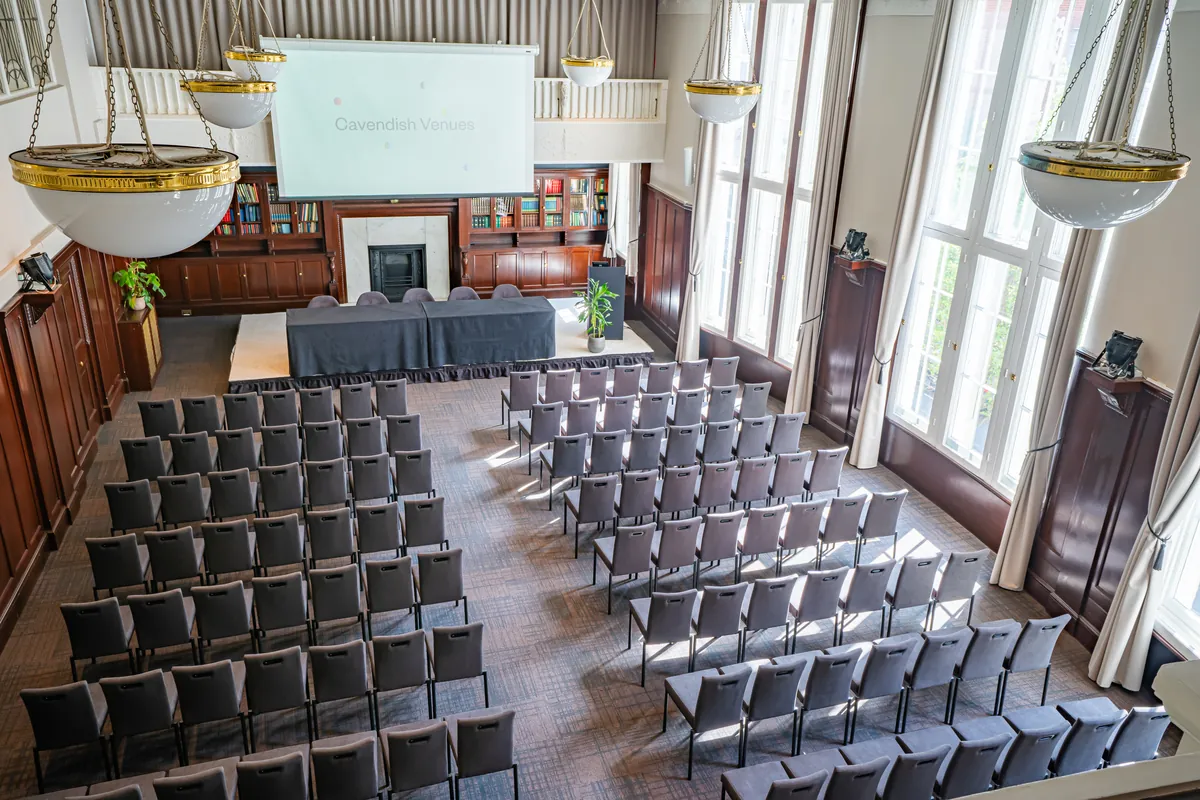 Tiered theatre seating set for an evening lecture at a Cavendish Venues London venue