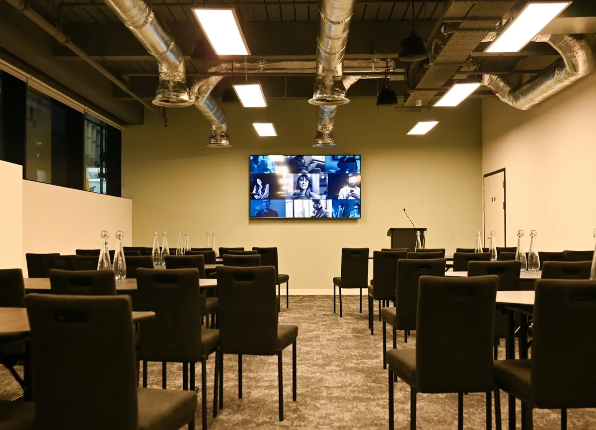 Training theatre with screen and exposed-services ceiling at a Cavendish Venues London venue