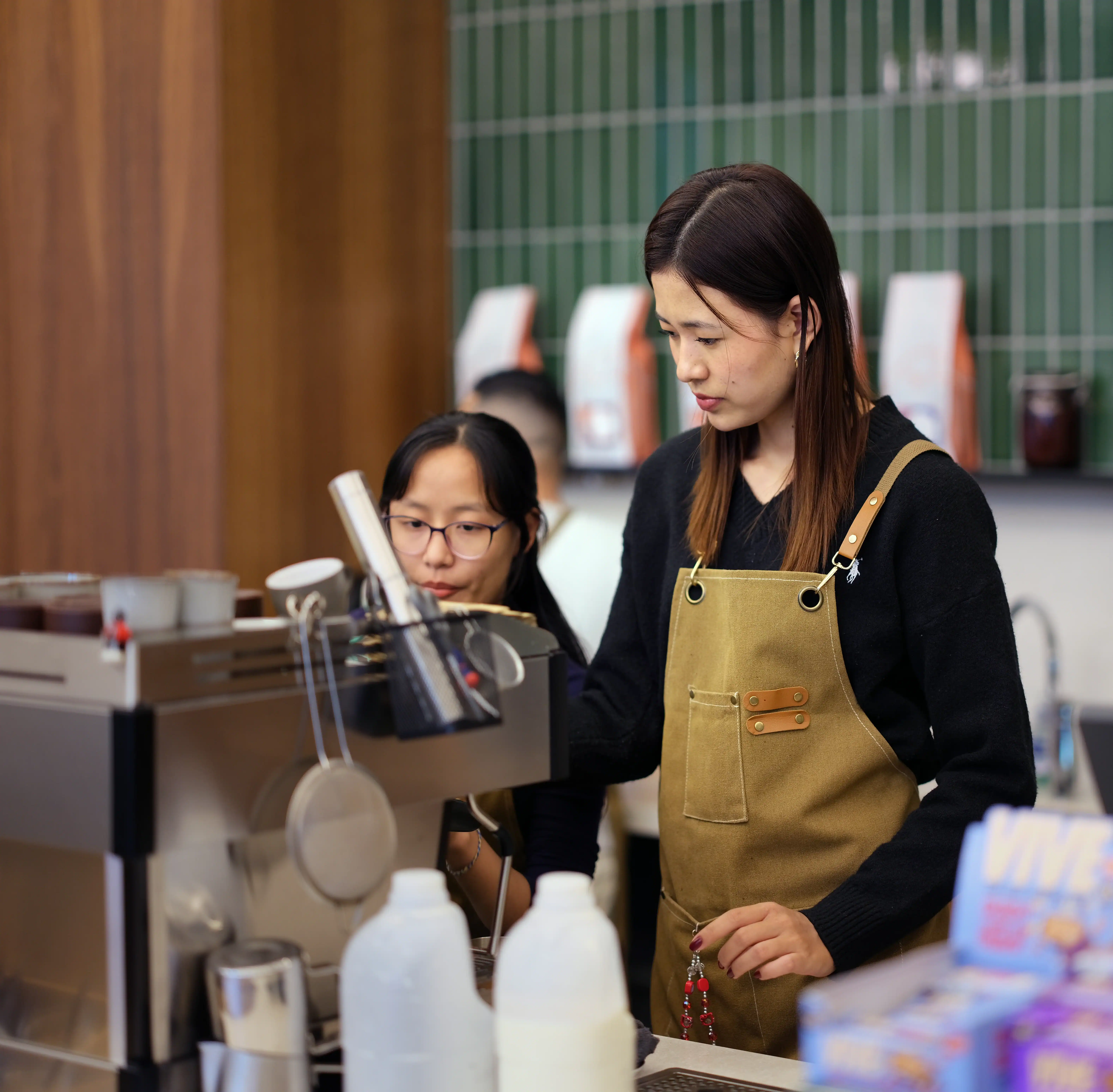 Baristas preparing coffee at the manned coffee station at 1 Basinghall Avenue