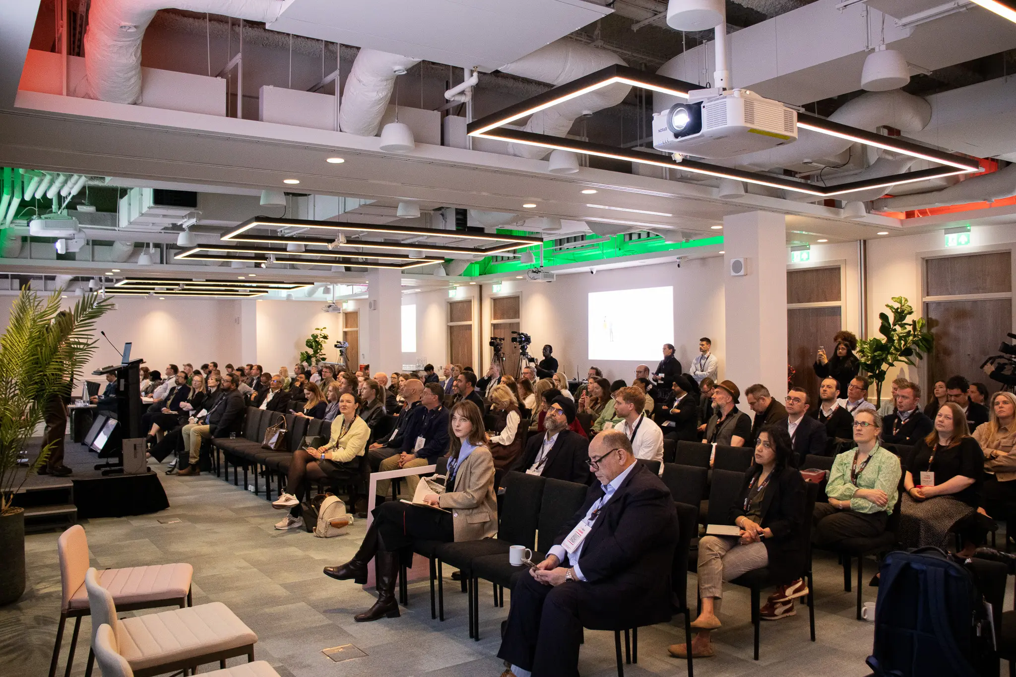 A full audience in the auditorium at 1 Basinghall Avenue during a conference