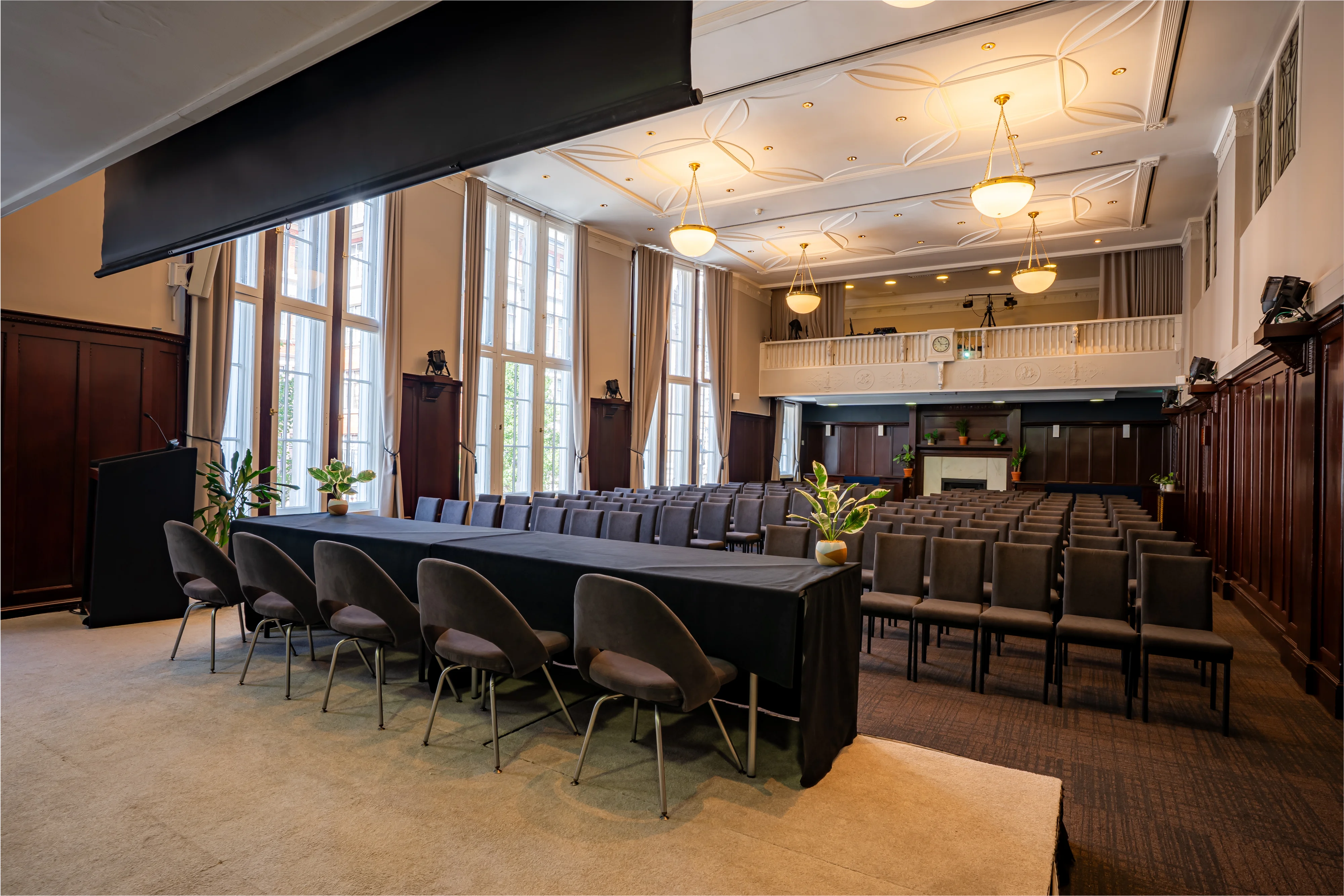 The Council Chamber at 44 Hallam Street set with a long table in front of the windows