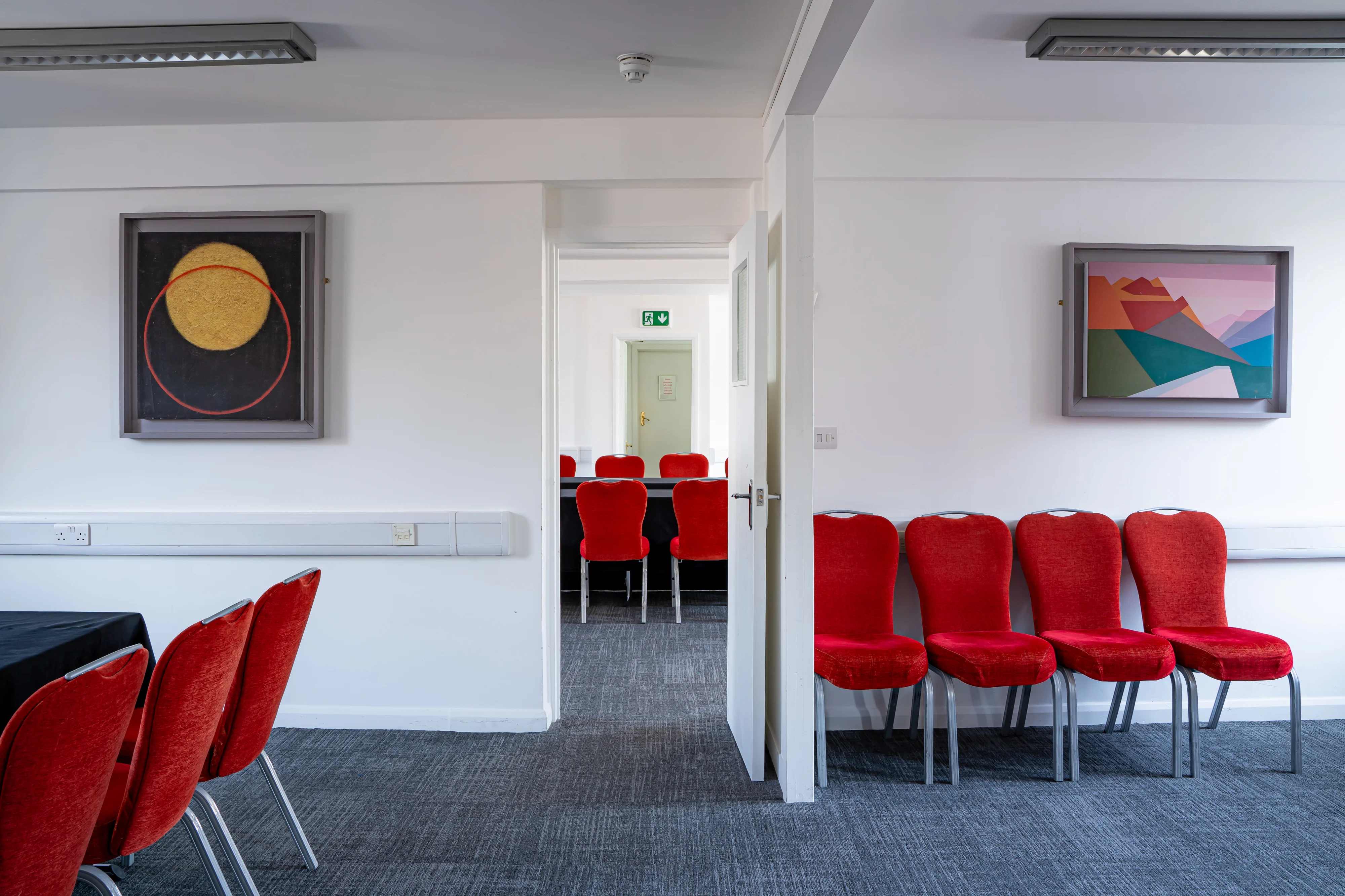 The Russell Suite at 44 Hallam Street set out theatre style with red chairs