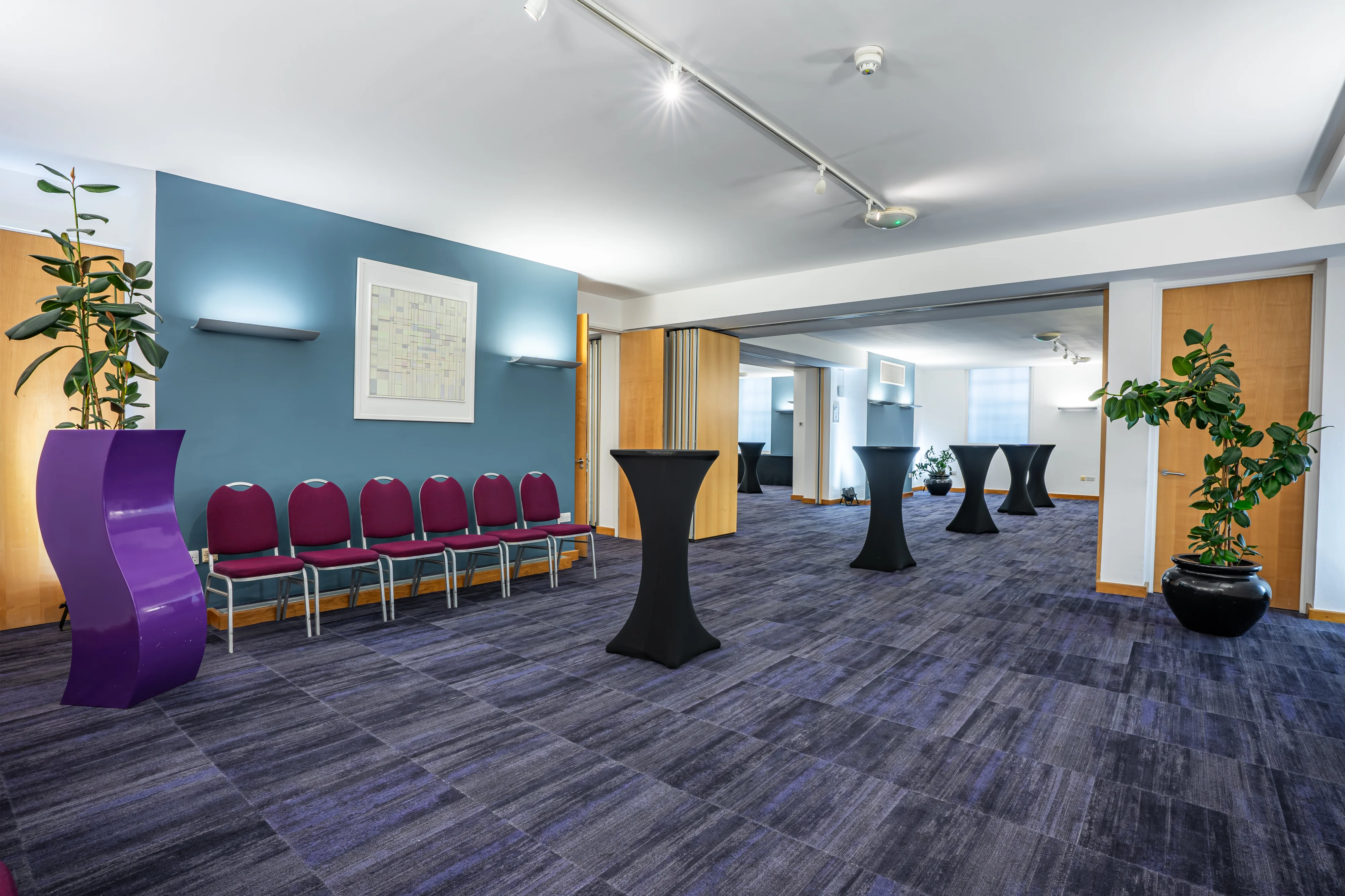 A room at 22 Duchess Mews arranged with rows of seating and poseur tables