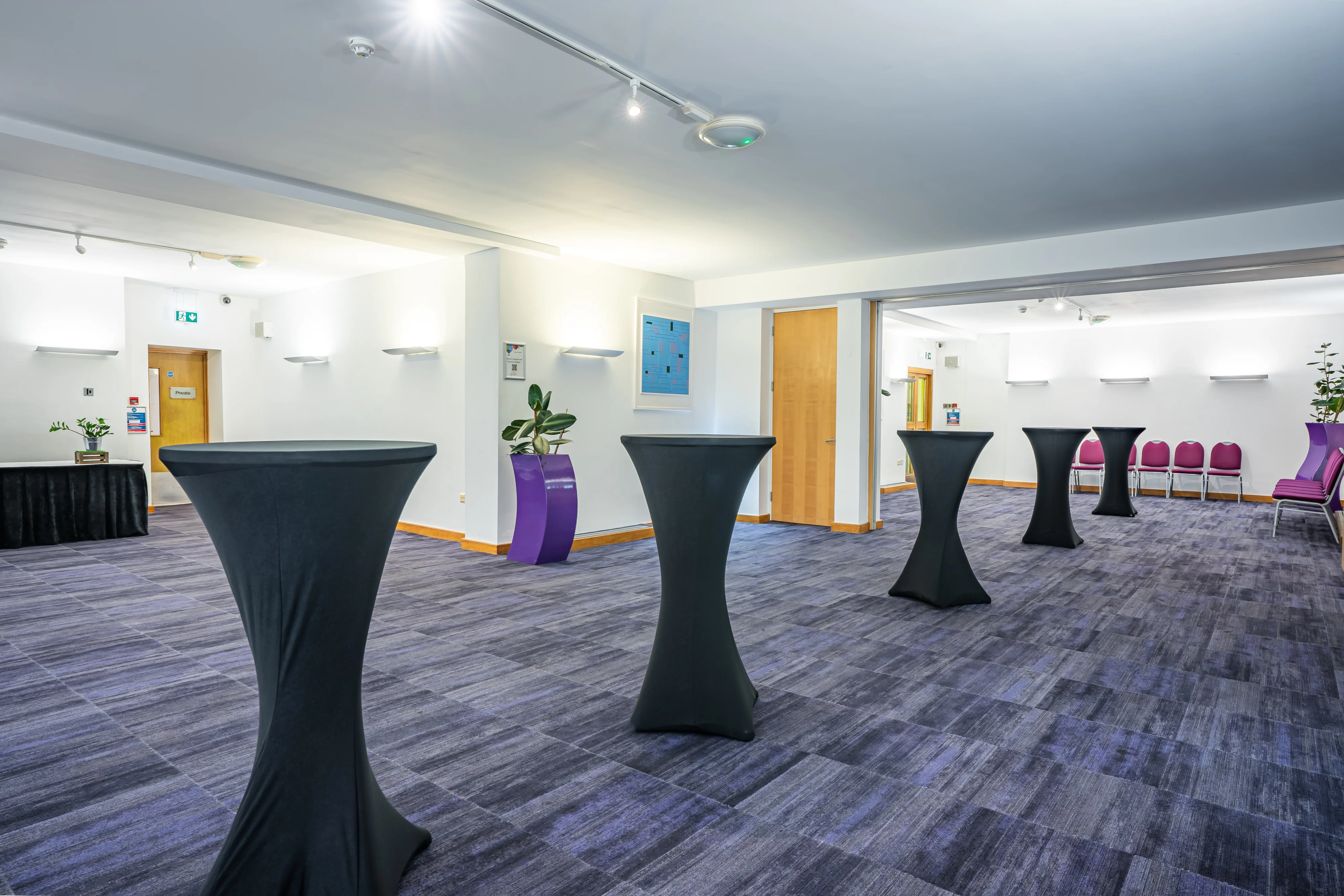 A room at 22 Duchess Mews set up with poseur tables for a reception