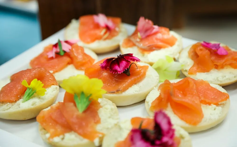 Smoked salmon canapes topped with edible flowers at 1 America Square