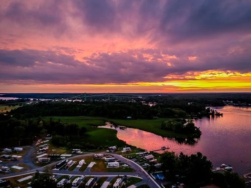 Sunset over Swan Bay Resort and marina in the Fall Foliage