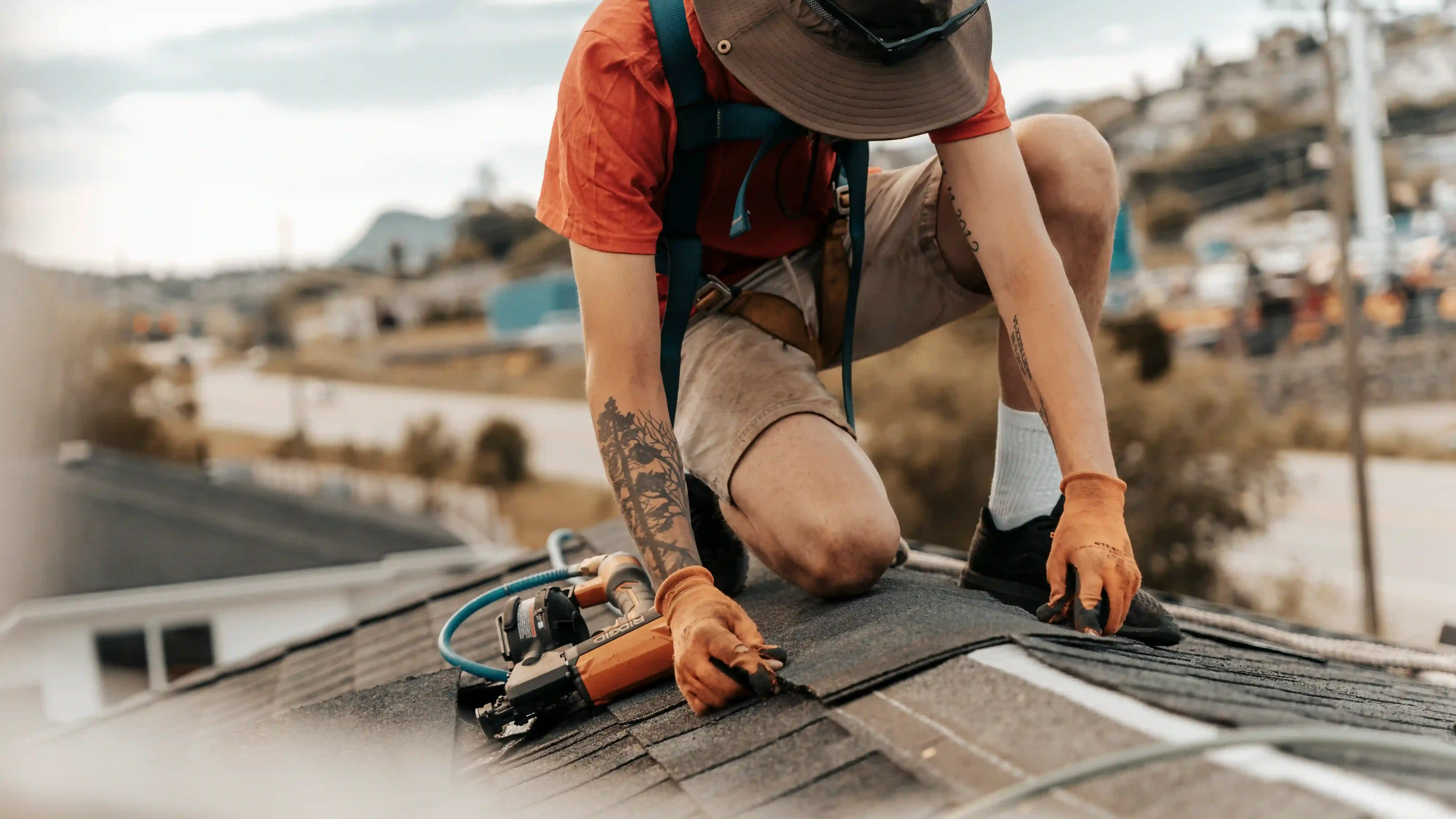 roofer placing roof parts onto roof