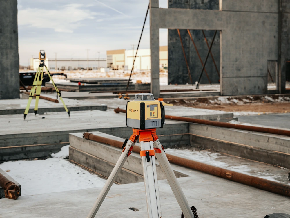 Concrete measuring tripod in foundations base