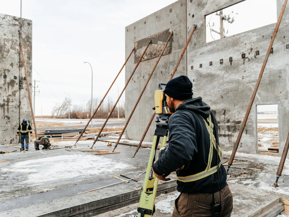 concrete worker levelling foundation base