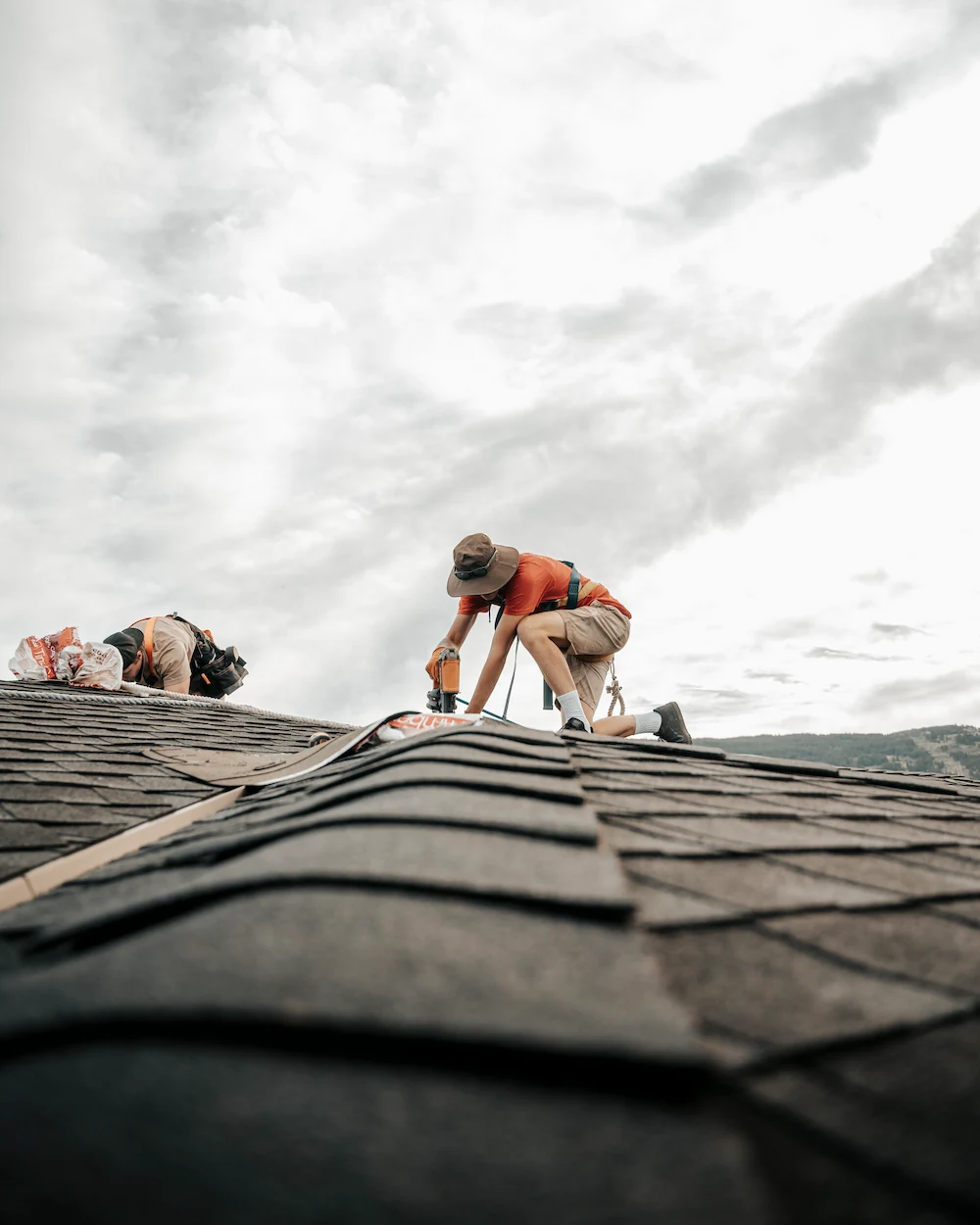 Roof Repair - worker fixing roof