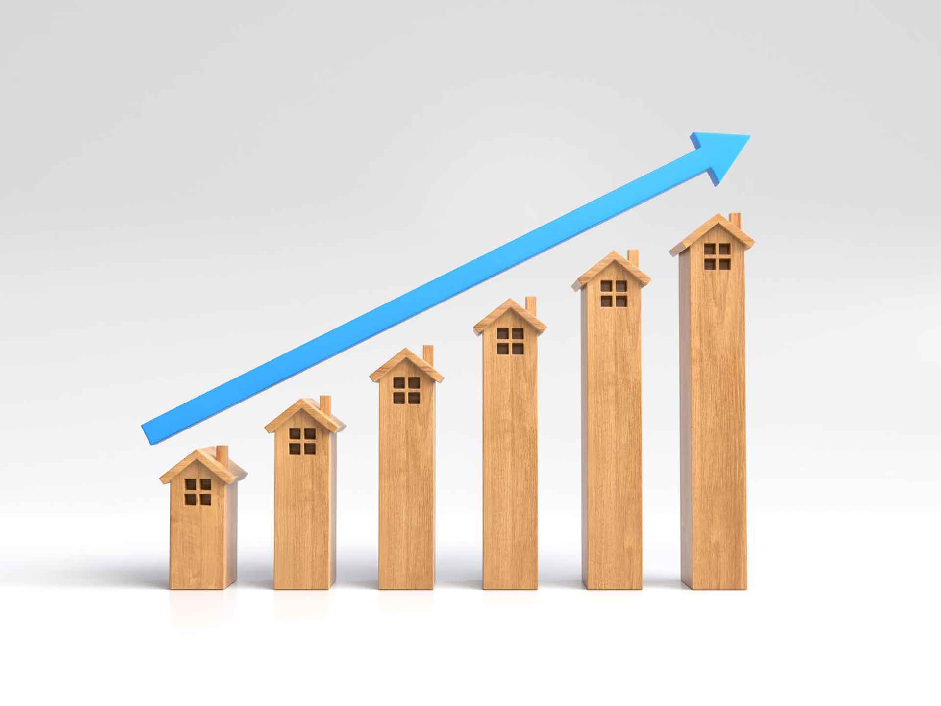 Row of wooden house blocks rising in height under an upward blue arrow