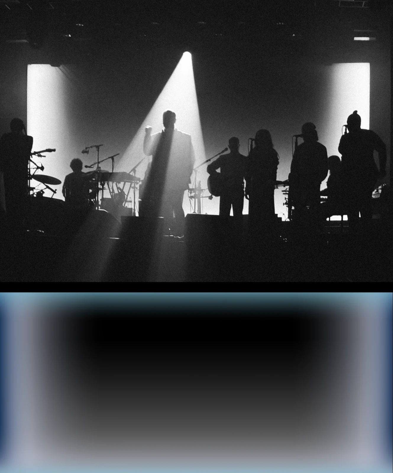 Stage silhouettes in white light above a pale-blue tonal study.