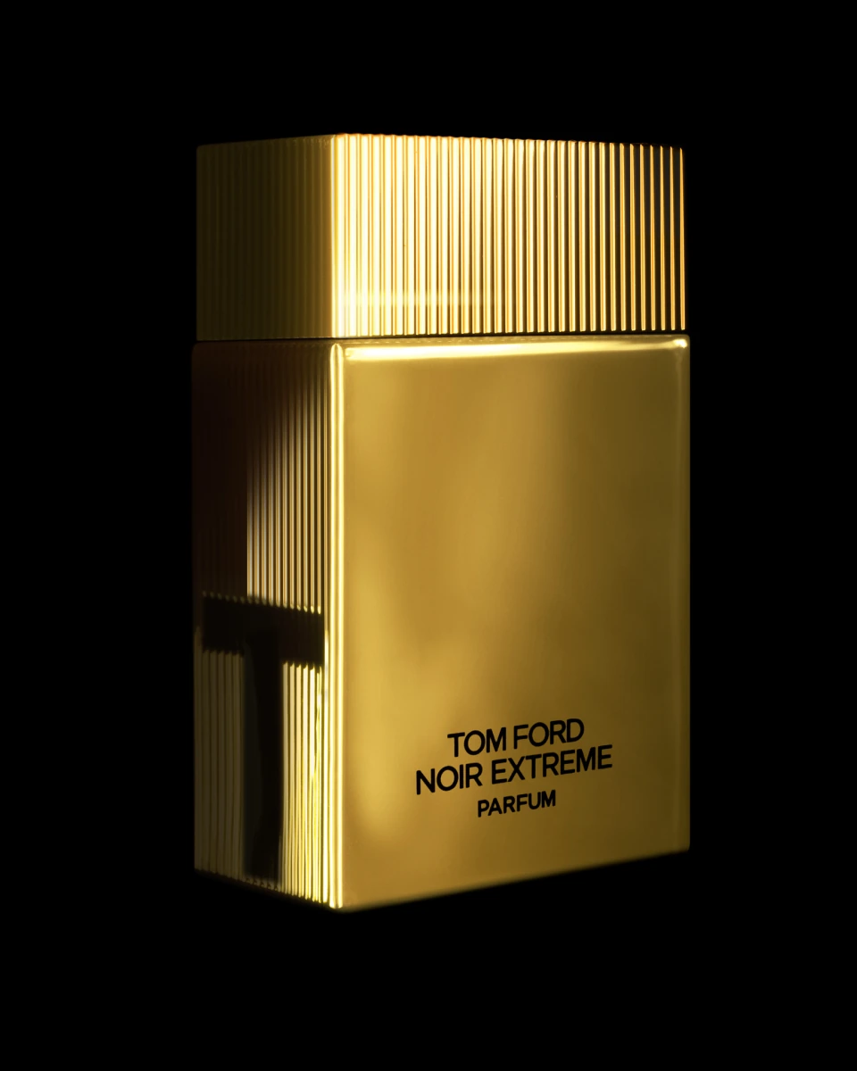 Tom Ford Noir Extreme Parfum in gold, against black.
