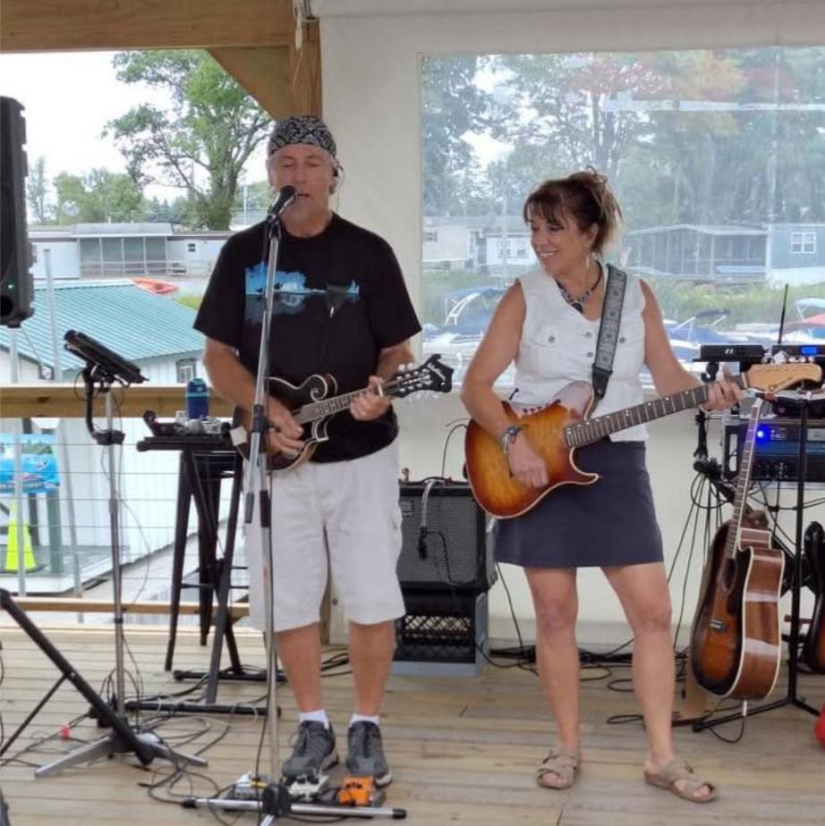 Second Nature performs live at a lively outdoor tiki bar by the water, August 29, 2025.