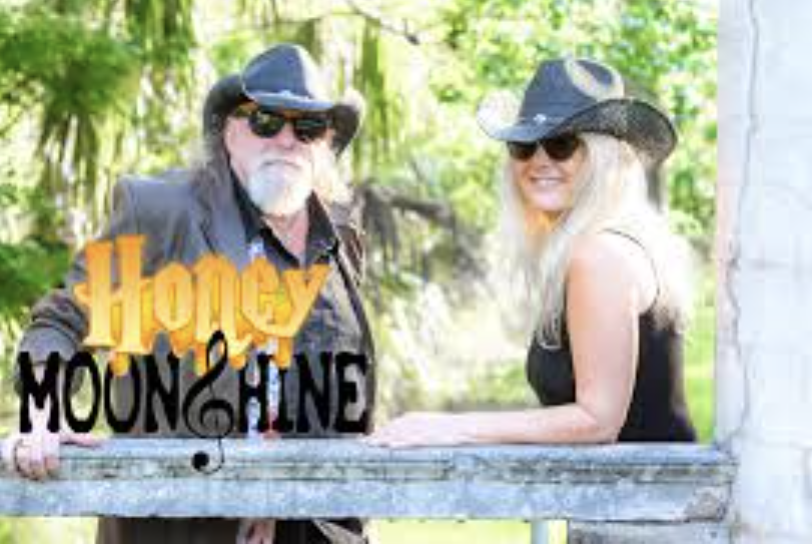 Live Music by Honey Moonshine Band, 2024: Lively performance with soulful tunes by the water.