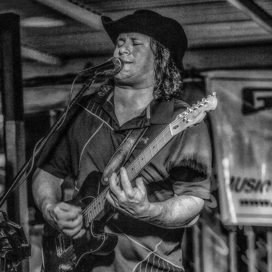 Gary Van Brocklin performing live at Why Knot Tiki Bar in July 2024. Soulful tunes by the water.