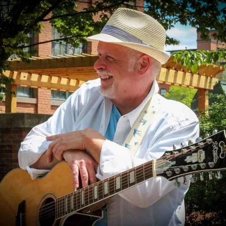 Live Music by Paul Davie, 2024: Paul Davie performs live at the Tiki Bar, creating a vibrant musical atmosphere.