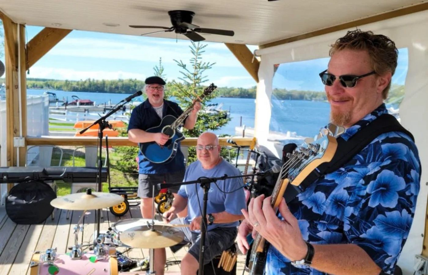 Live music performance by The Bad Husbands Club at Swan Bay Resort's Tiki Bar.