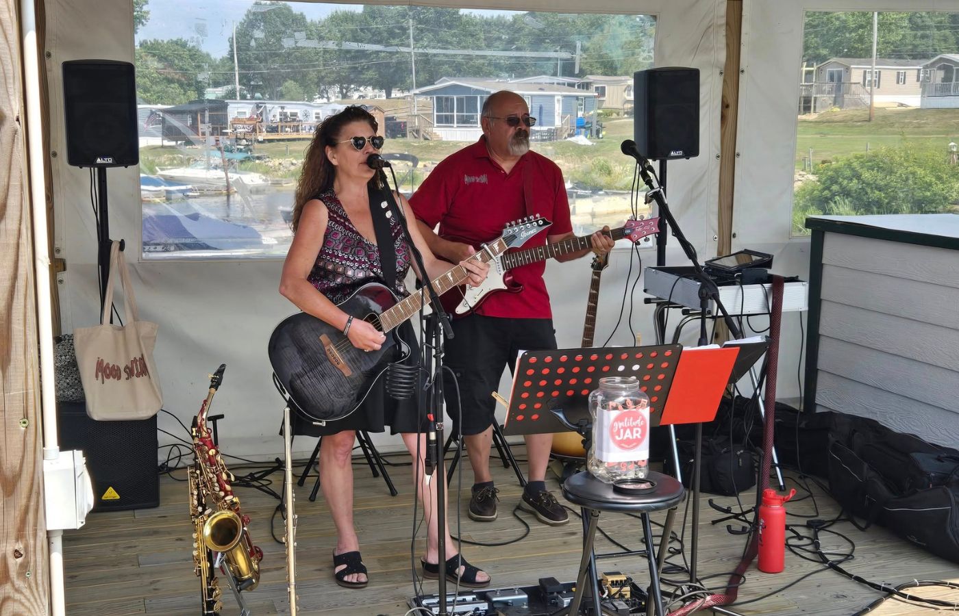 Live music performance by Mood Swing Duo at Swan Bay Resort's Tiki Bar.