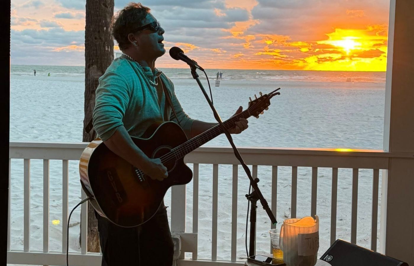 Live music performance by Gary VanBrocklin at Swan Bay Resort's Tiki Bar.