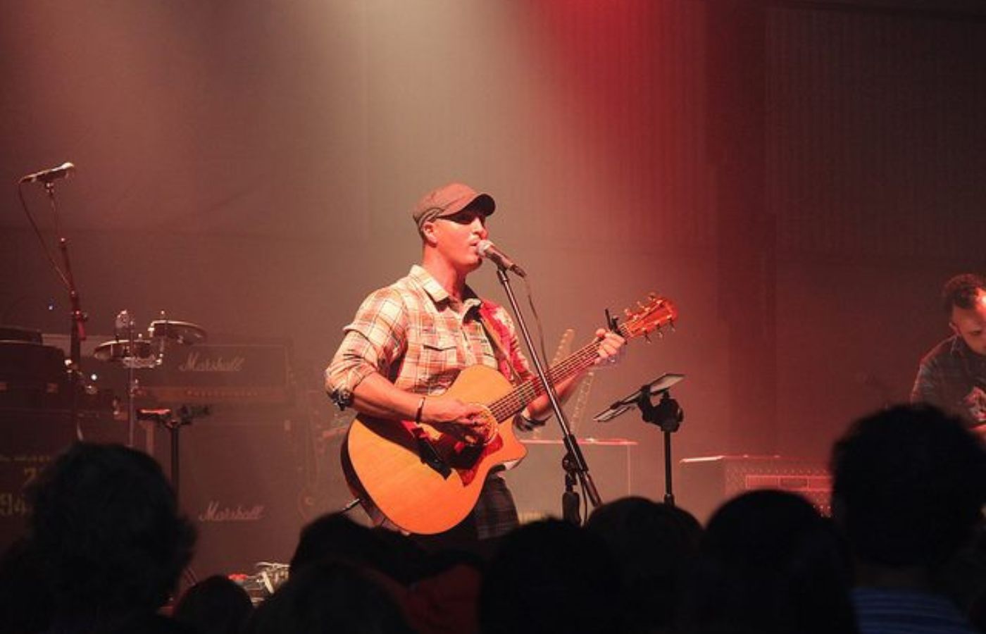 Live music performance by Travis Rocco at Swan Bay Resort's Tiki Bar.