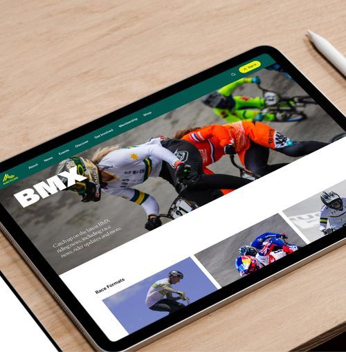 An AusCycling website mock-up showing a page about BMX on an iPad device