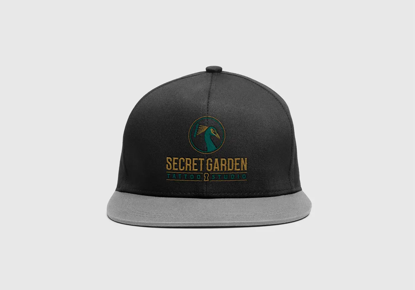 Example of Secret Garden branding applied to a black and gray snapback cap