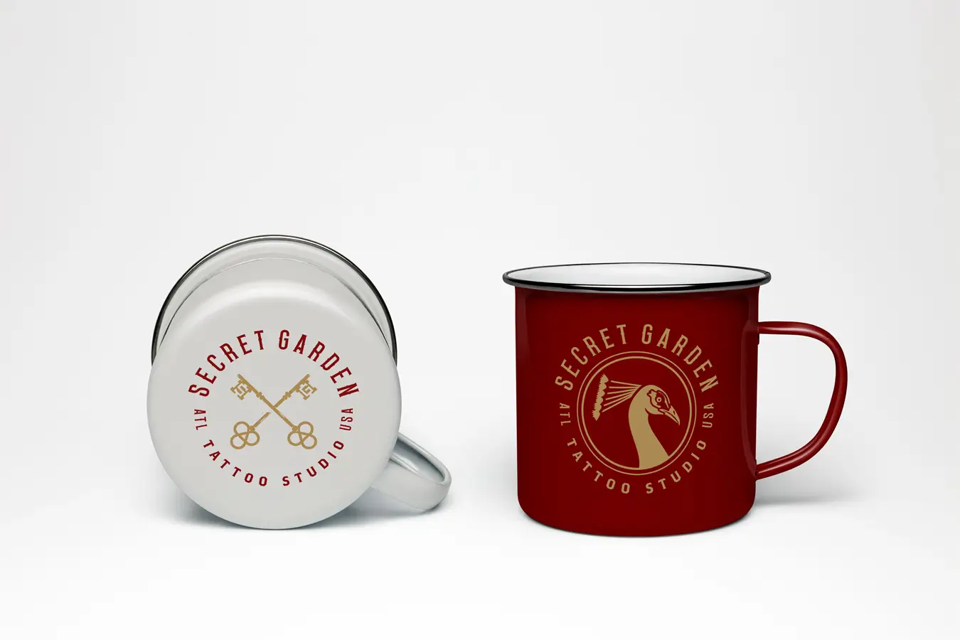 Example of Secret Garden branding applied to two enamel mugs, one white, and one red