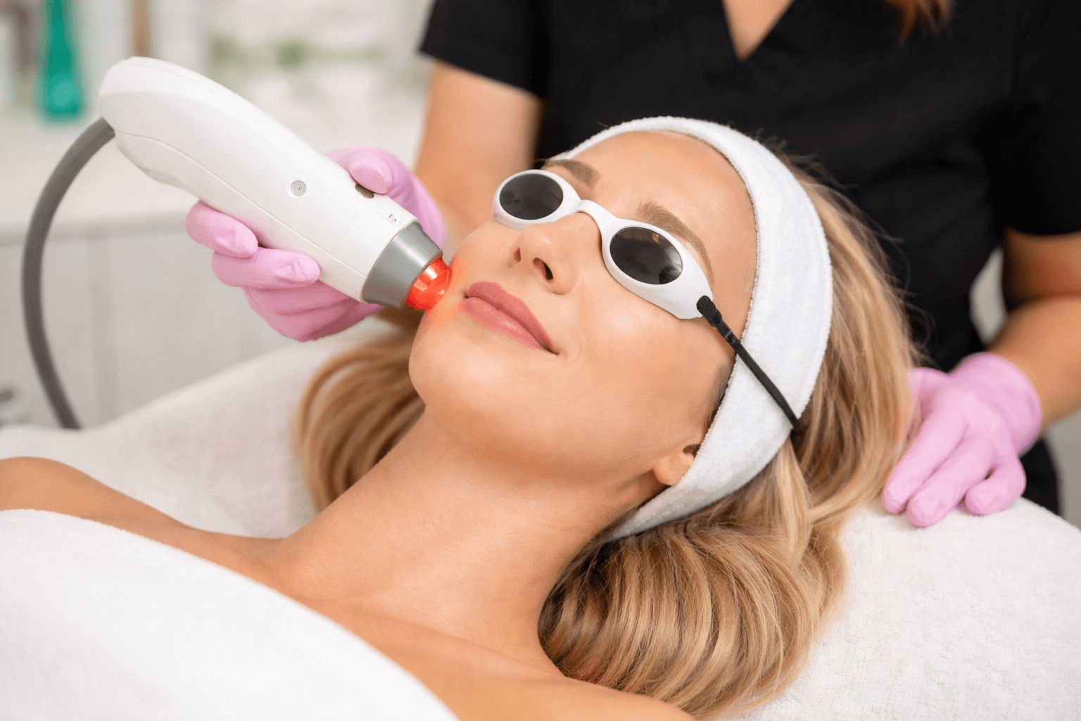  Patient receiving laser facial treatment at Envy MedSpa in Wichita Falls, Texas for skin rejuvenation