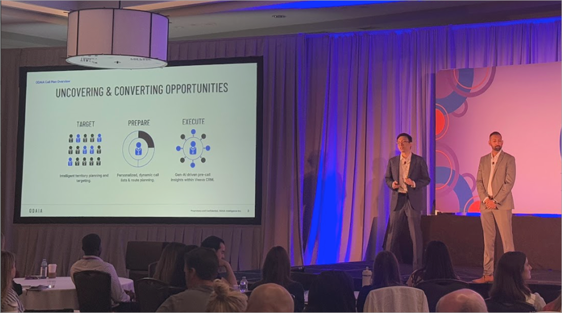 ODAIA BA team presenting on stage at pharma sales team training. 