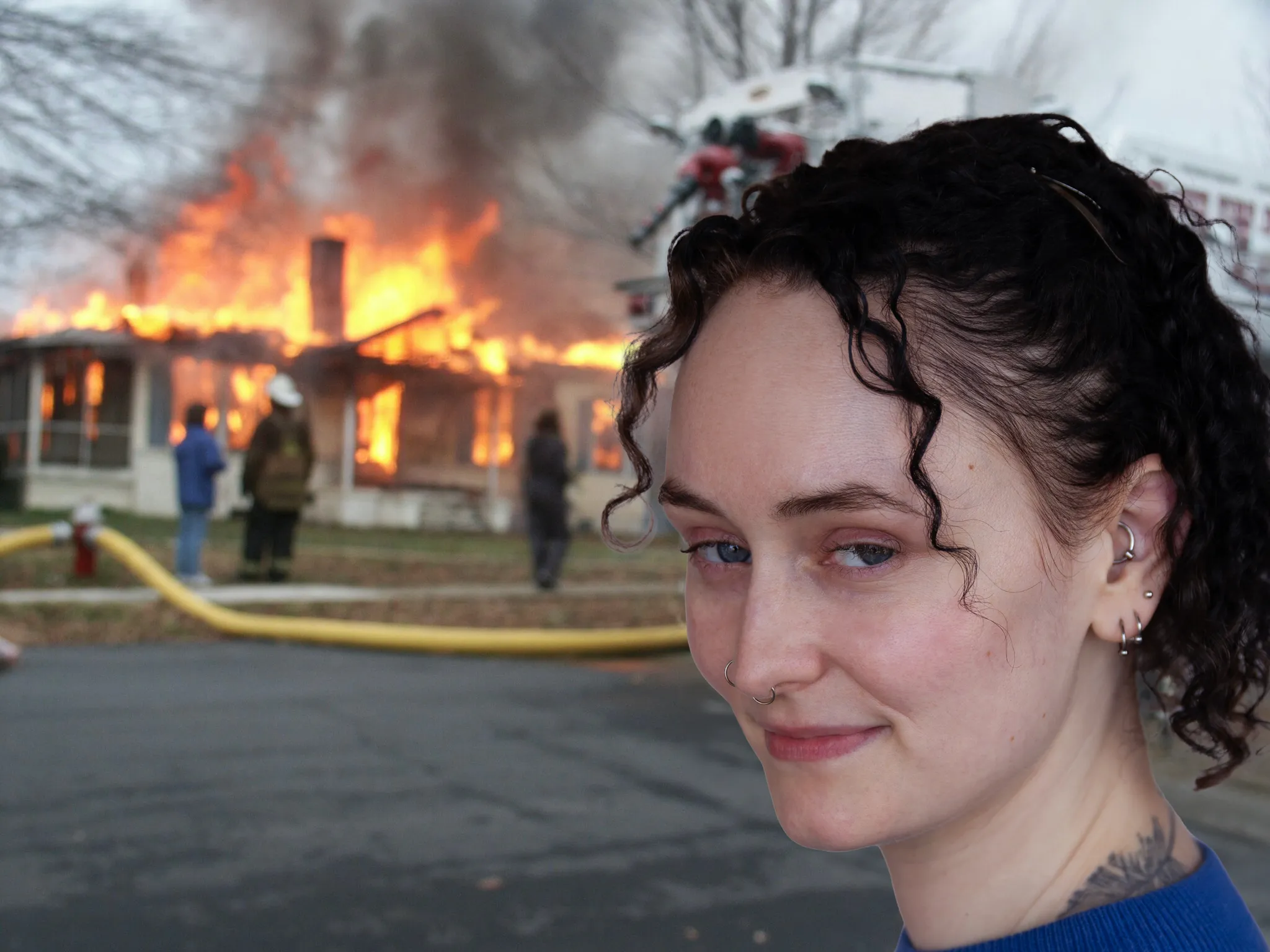 Photoshopped image of Ember in front of a burning house, resembling a popular meme