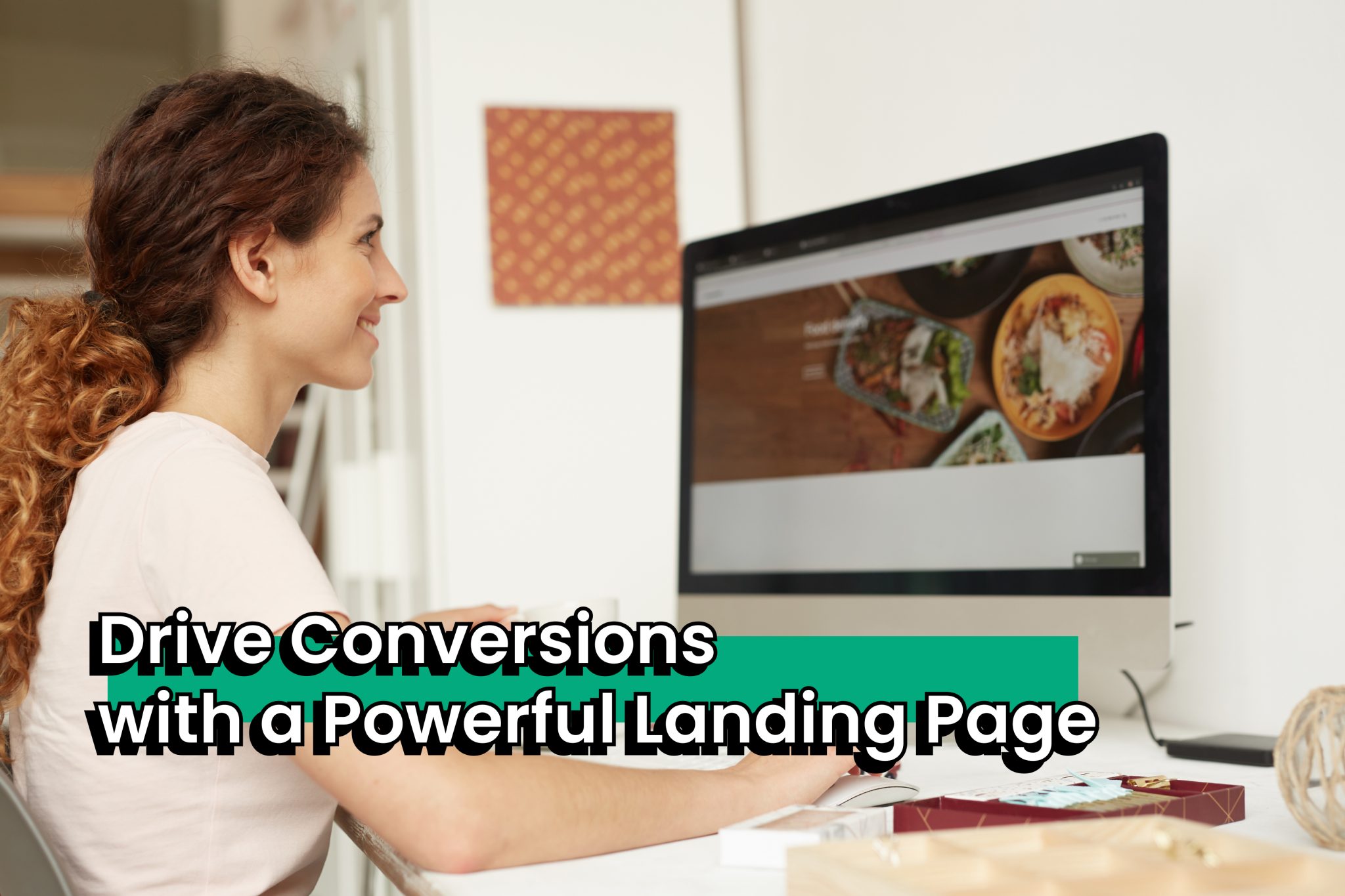 Woman smiling at computer screen displaying food images while working at desk