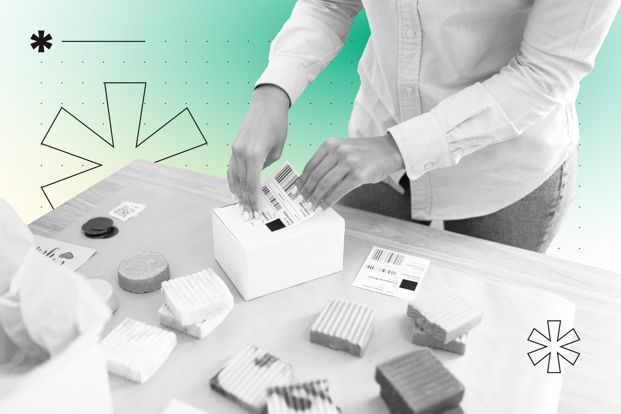 Person packing subscription box with barcode label, surrounded by various product samples on table