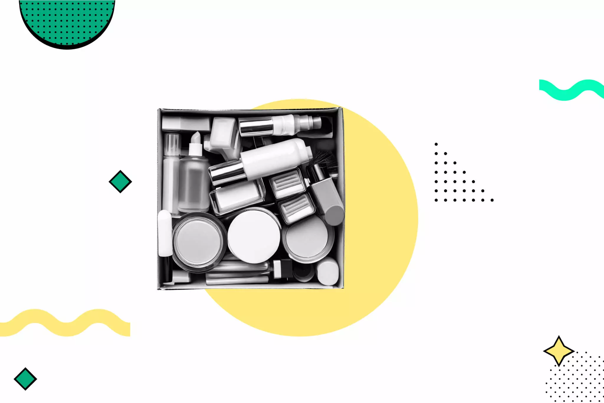 Overhead view of cosmetic products in silver, white and black packaging arranged in a black box on a yellow circular backgrou