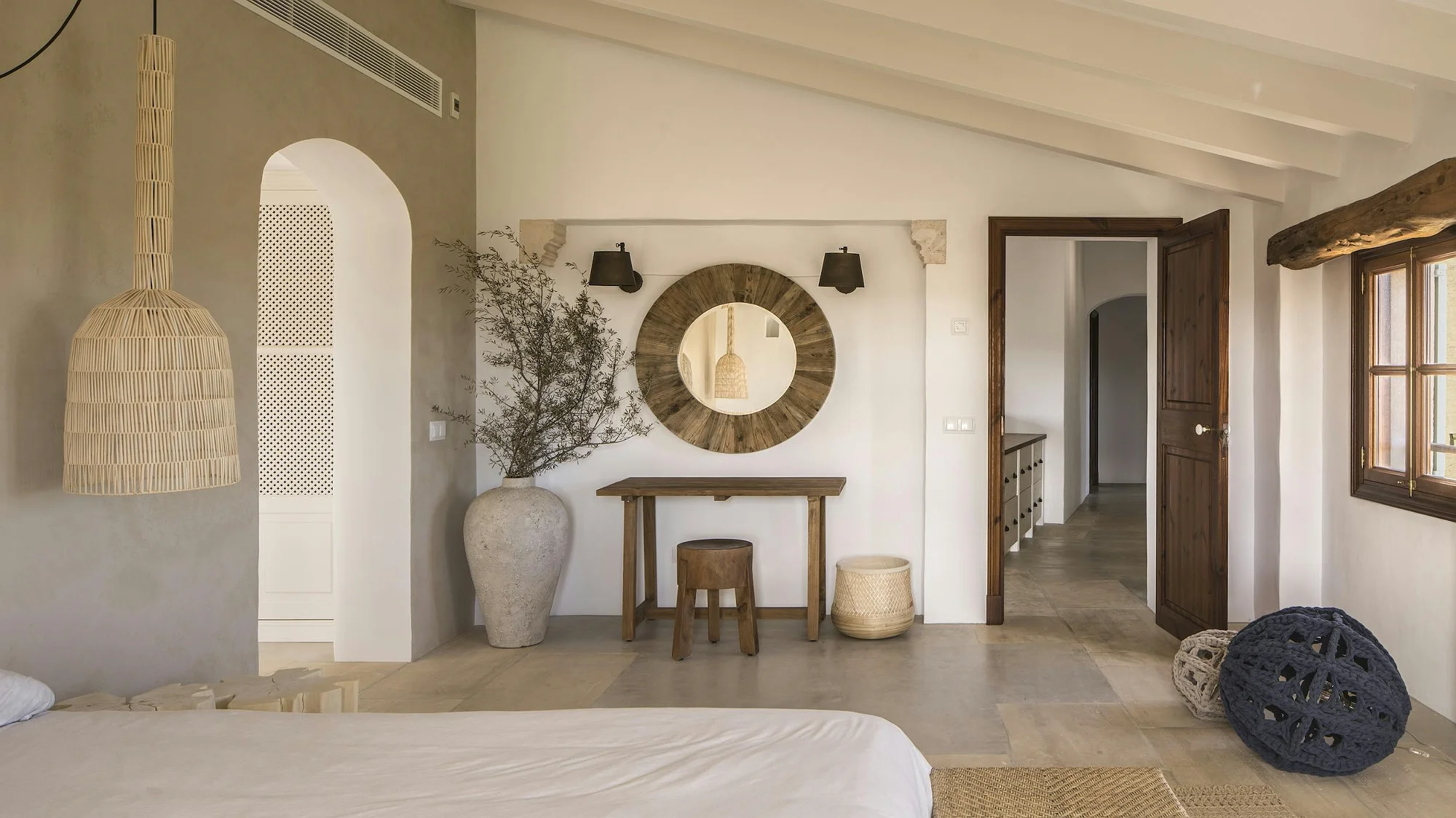 Stylish bedroom interior with wooden details and mirror in ByMilagro luxury holiday villa Mallorca