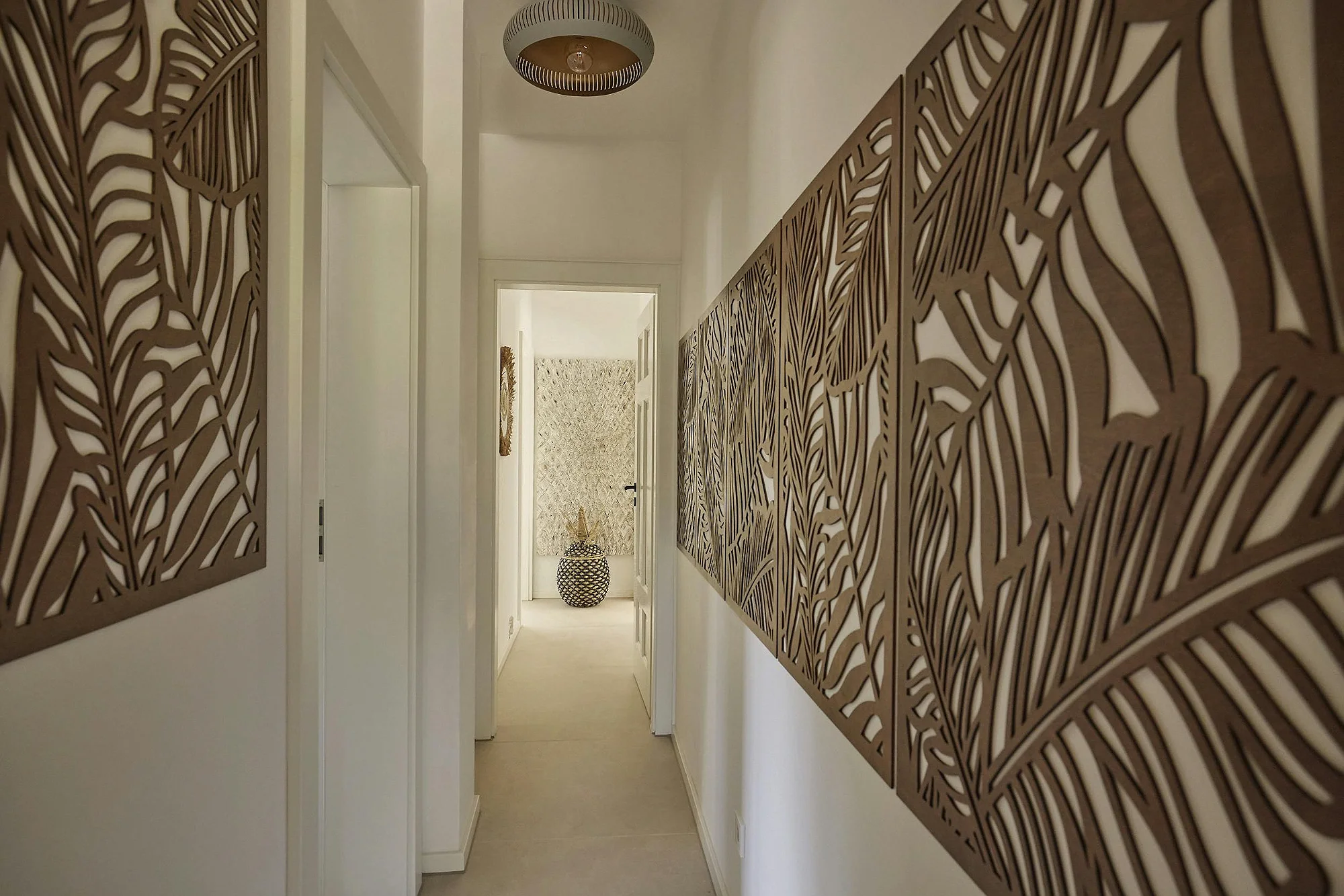 Hallway with artistic wall panels at ByMilagro luxury holiday villa Mallorca