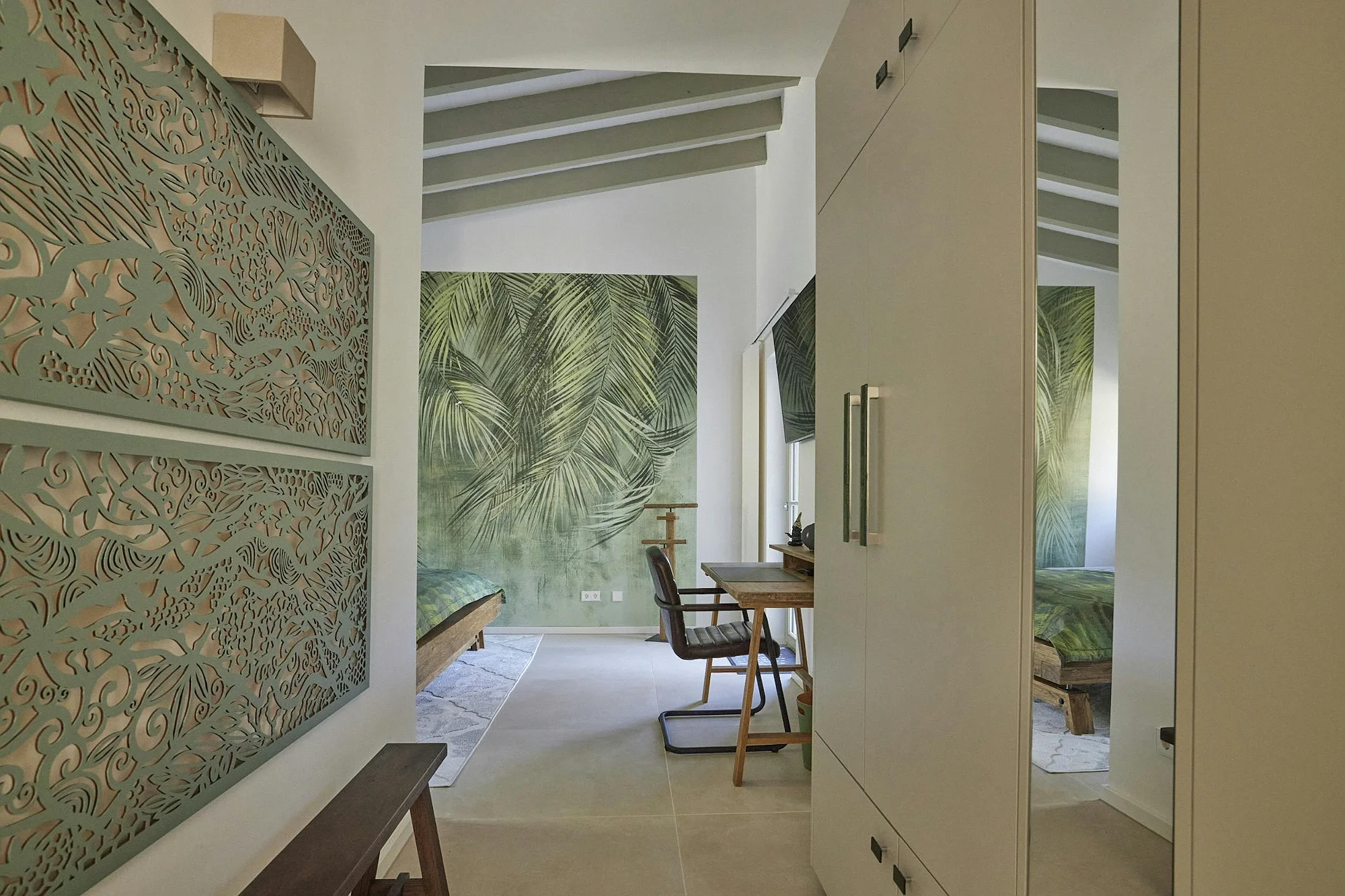 Bedroom workspace with tropical decor wall and modern furniture in ByMilagro villa Mallorca