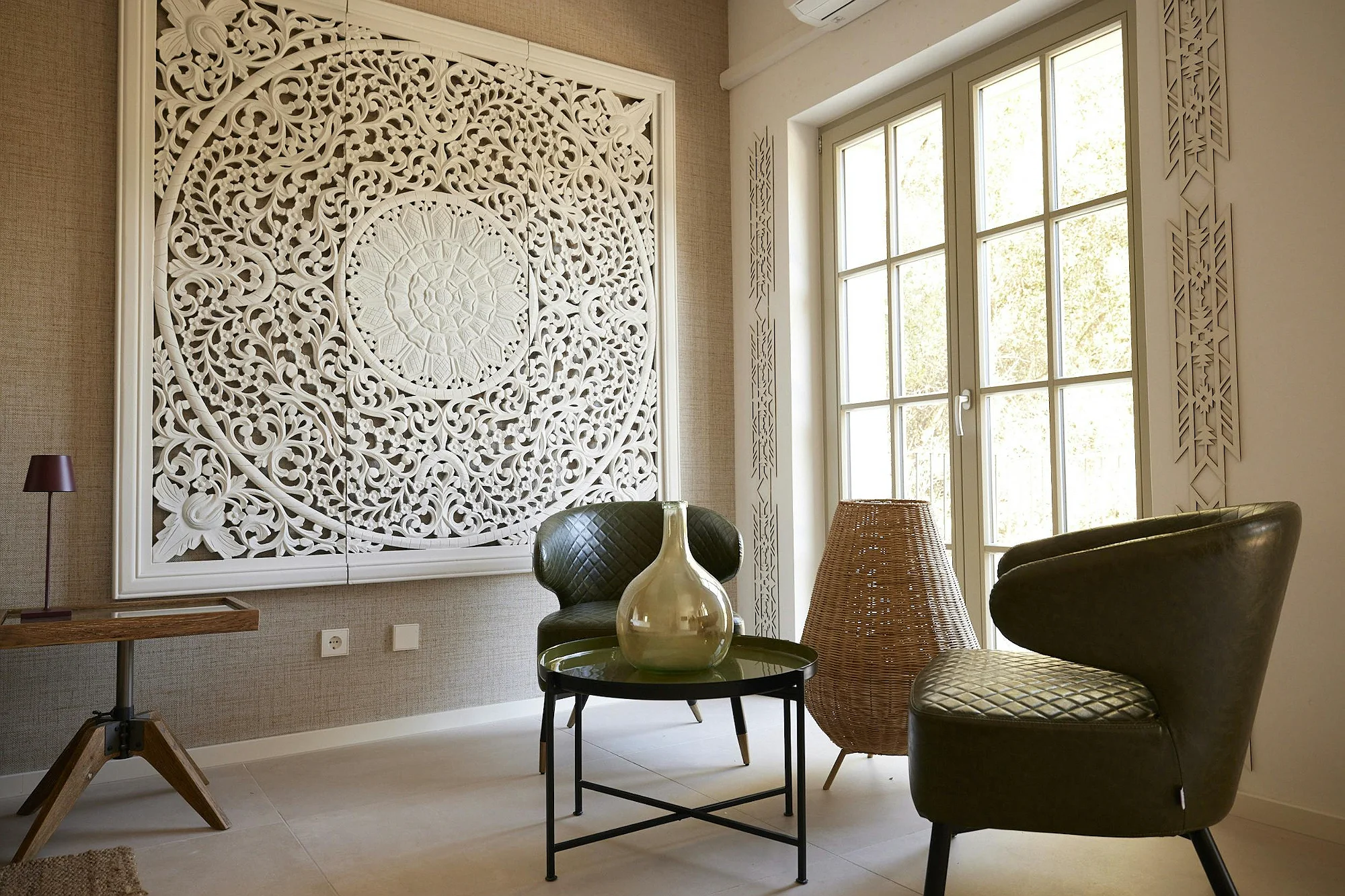 Elegant interior lounge with carved wall art at ByMilagro luxury holiday villa Mallorca