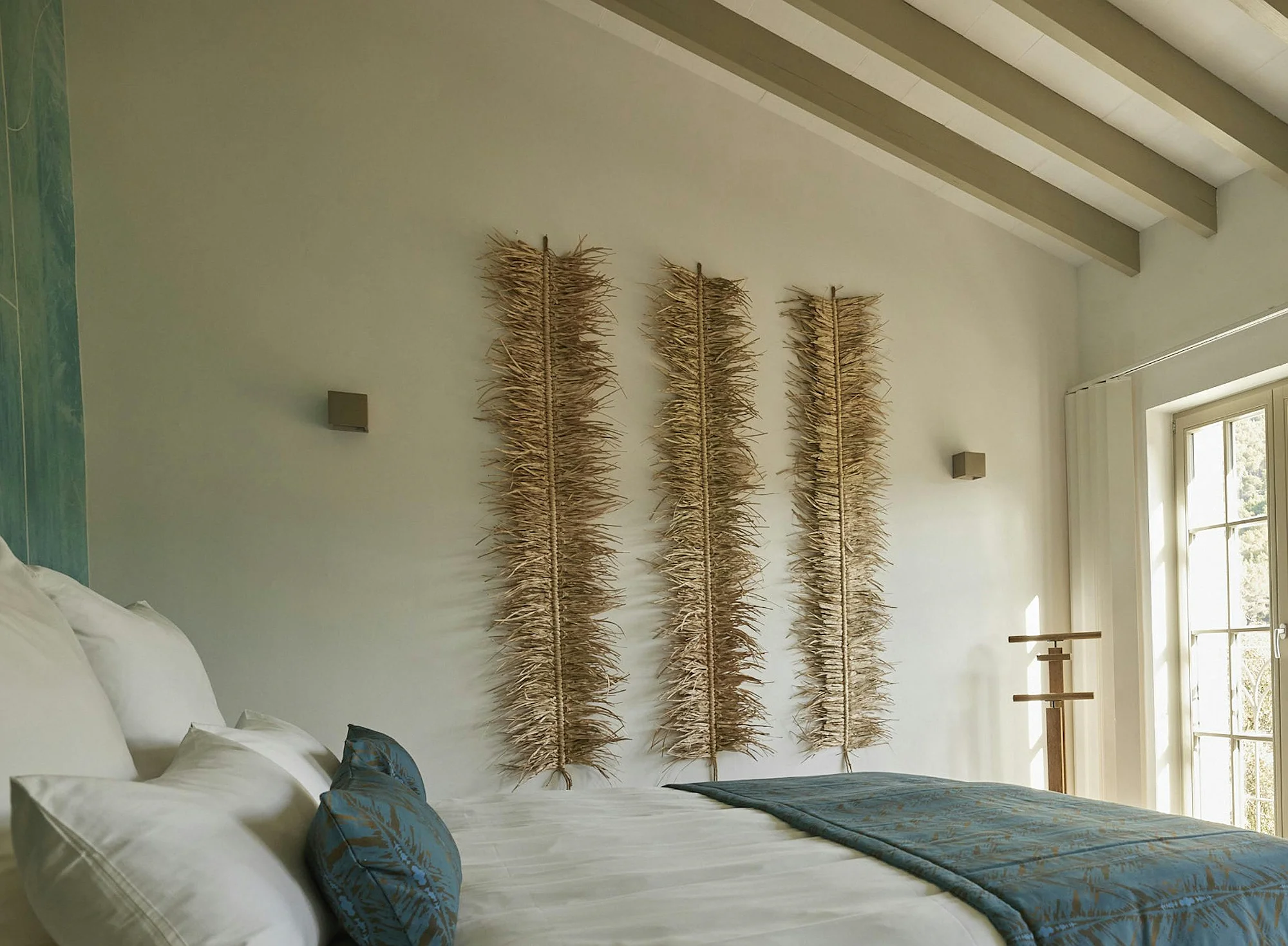 Bedroom with natural light and rustic decor in ByMilagro luxury holiday villa Mallorca