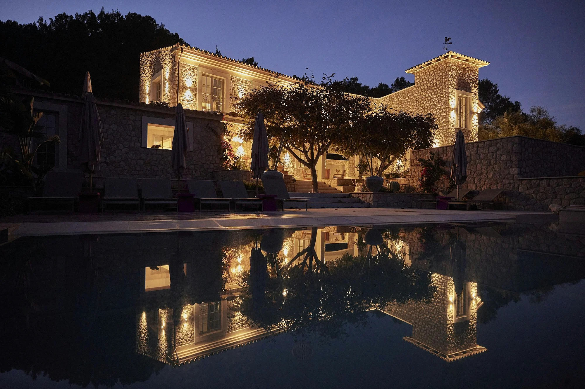 ByMilagro luxury villa Mallorca reflected in swimming pool at night