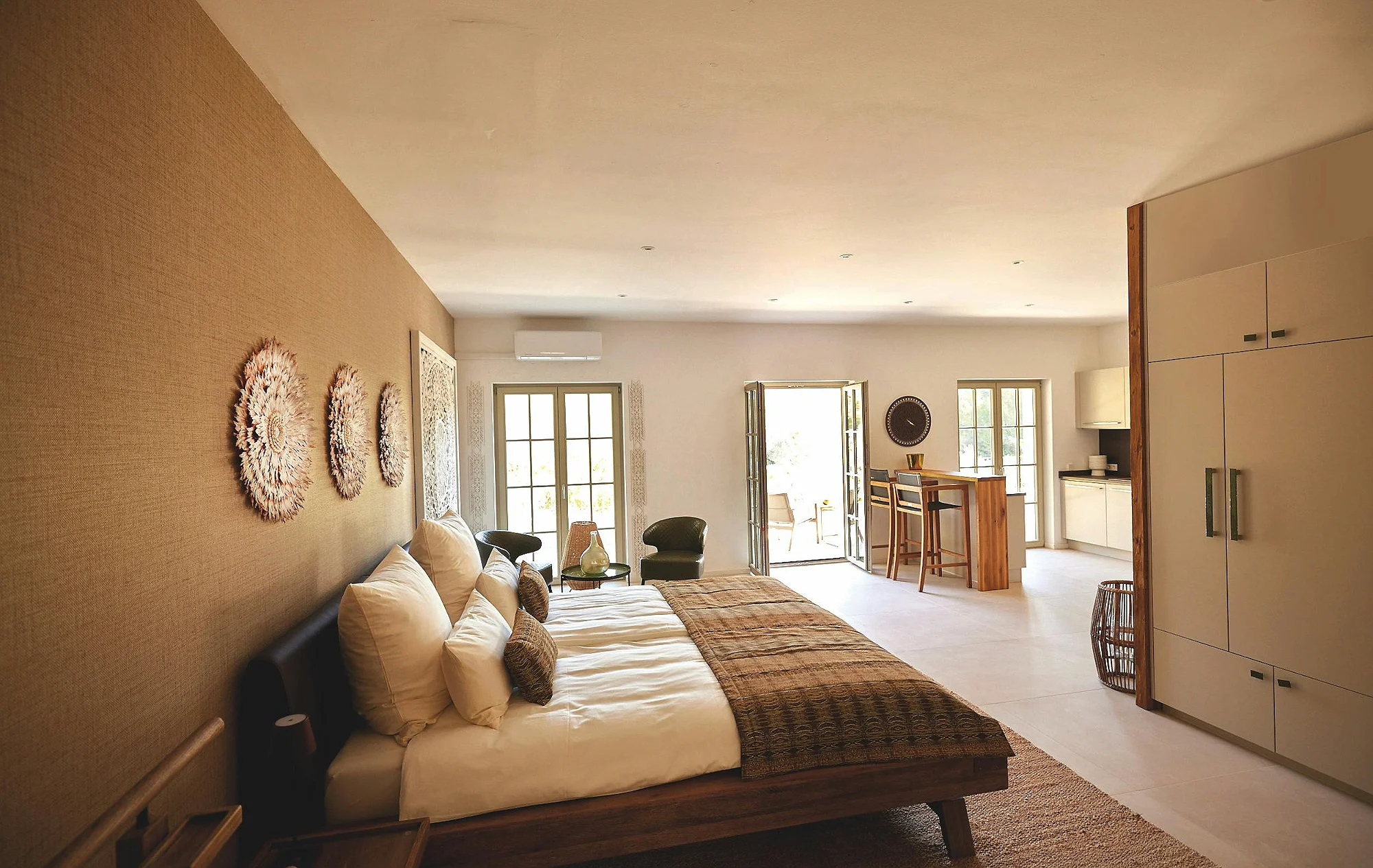 Spacious bedroom suite with kitchen and lounge at ByMilagro luxury villa Mallorca