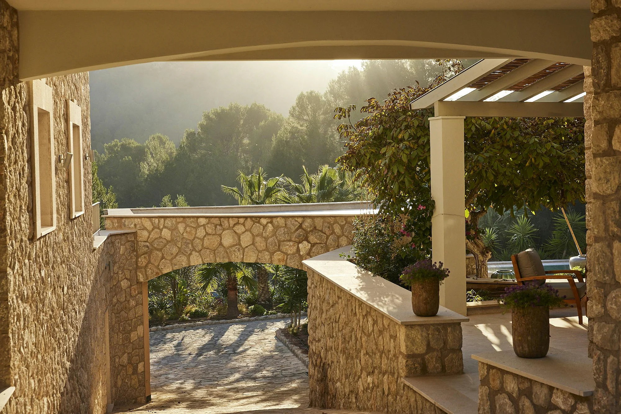 Sunset view of terrace and stone walls in ByMilagro villa Mallorca