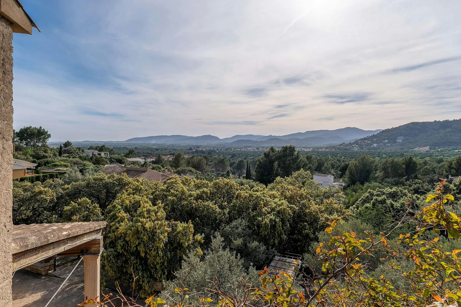 Luxury villa rental view from terrace, featuring lush Mediterranean landscape and mountain views. ByMilagro luxury property.