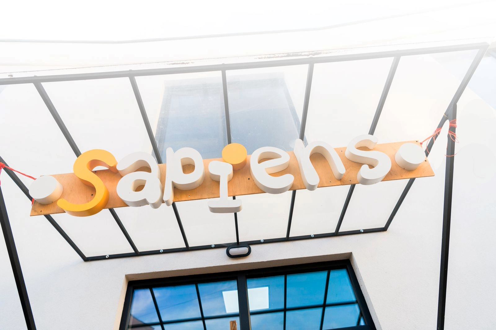 A school entrance with Sapiens logo 