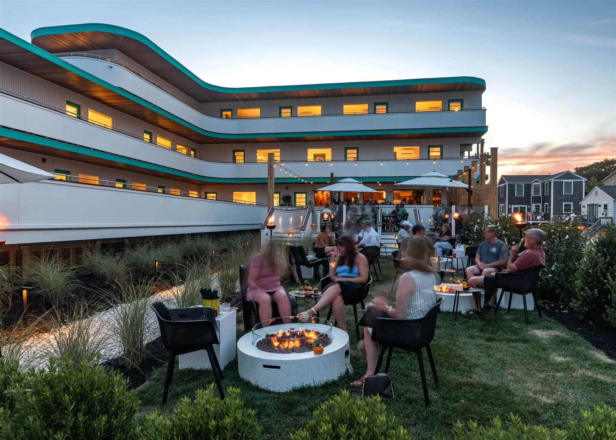 Lulu's restaurant at The Nevada Hotel in York Beach, Maine. Diners are sitting outside by fire pits.