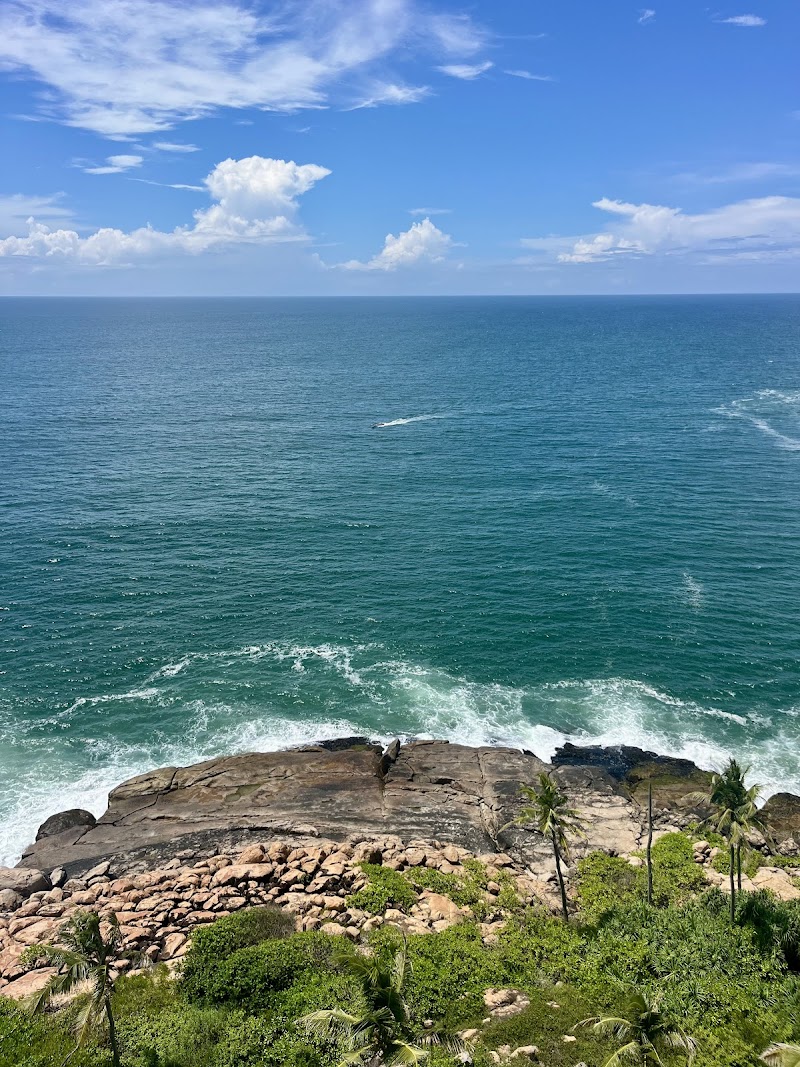 Visiting the Lighthouse at Light House Beach - Kovalam - India - booked ai