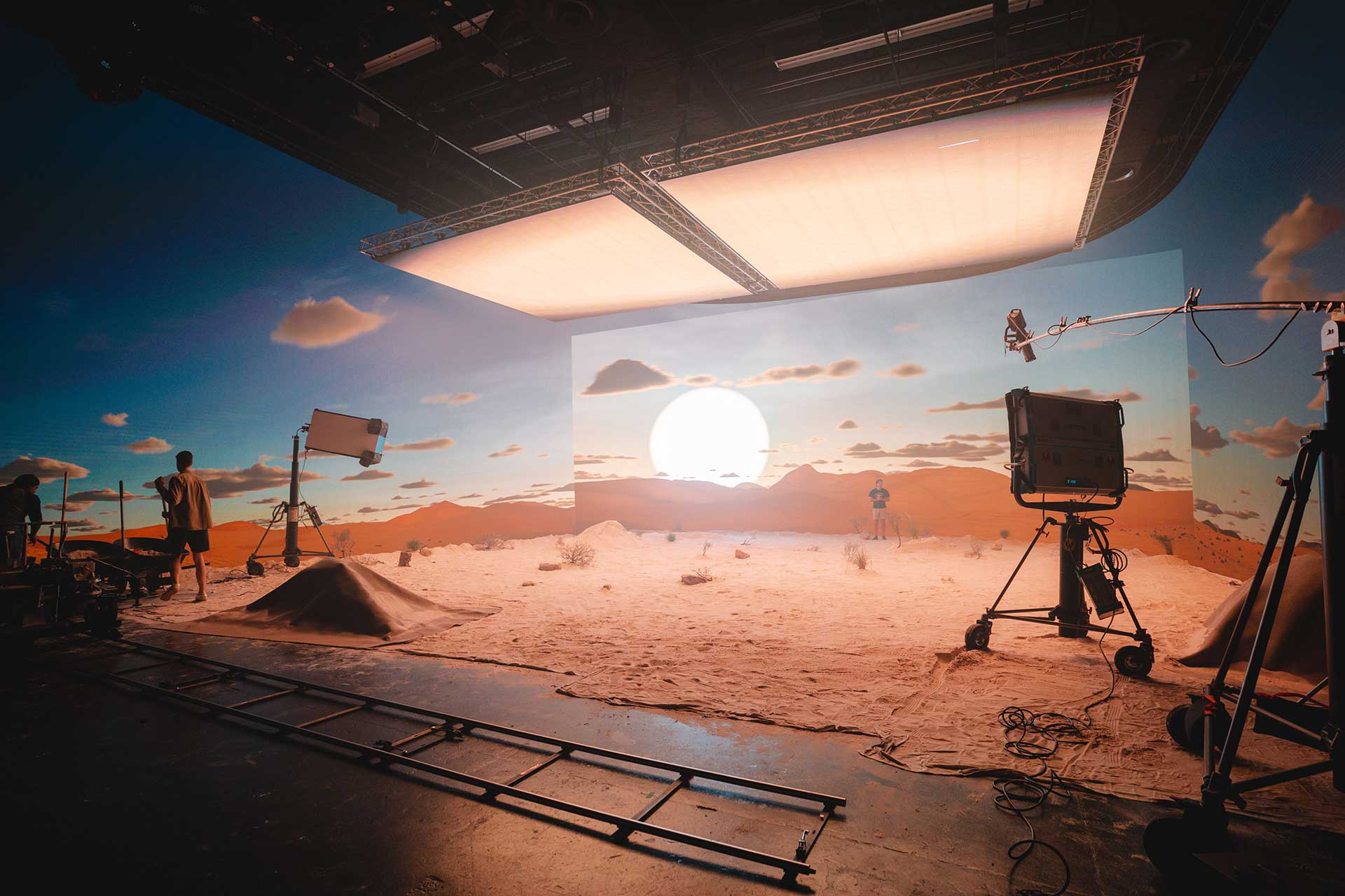 A studio setup with a sun setting in the background.