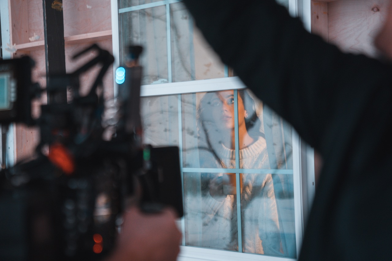 Virtual production with real-time environmental frame adjustment.